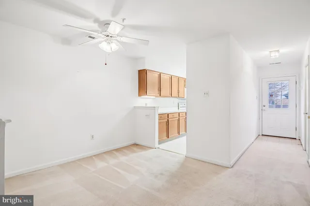 a kitchen with stainless steel appliances granite countertop a refrigerator and a stove