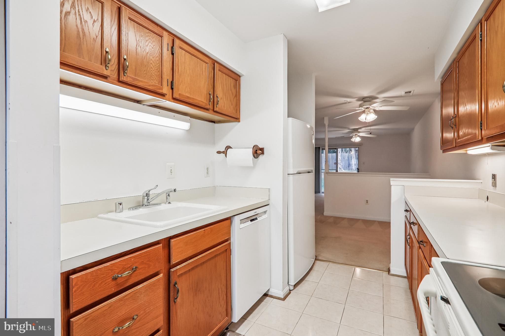 9272 Cherry Lane, Unit 75 Laurel, MD 20708 - Photo 20 of 37 a bathroom with a sink a vanity and a mirror