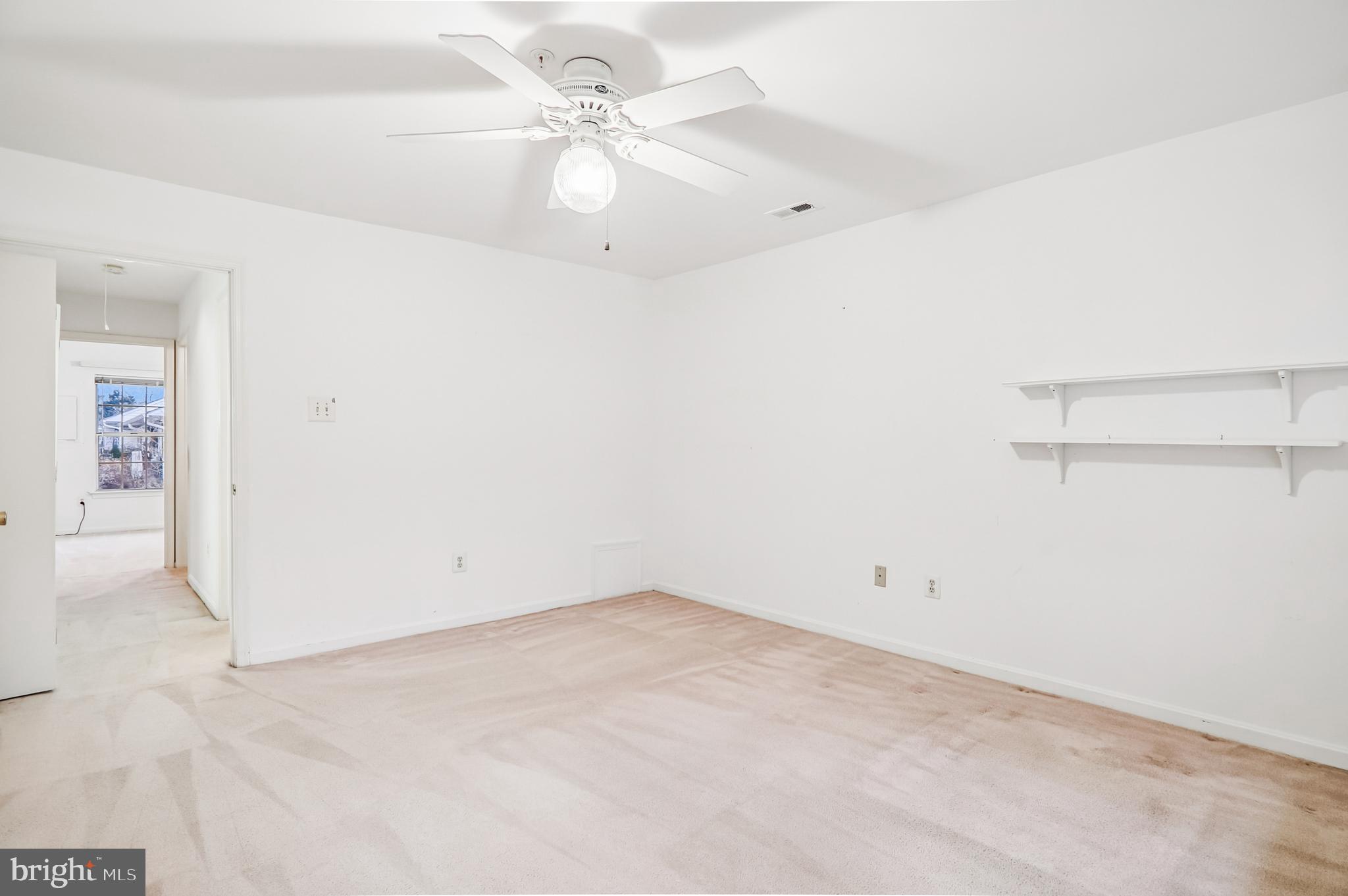 9272 Cherry Lane, Unit 75 Laurel, MD 20708 - Photo 24 of 37 an empty room with a fan & a window