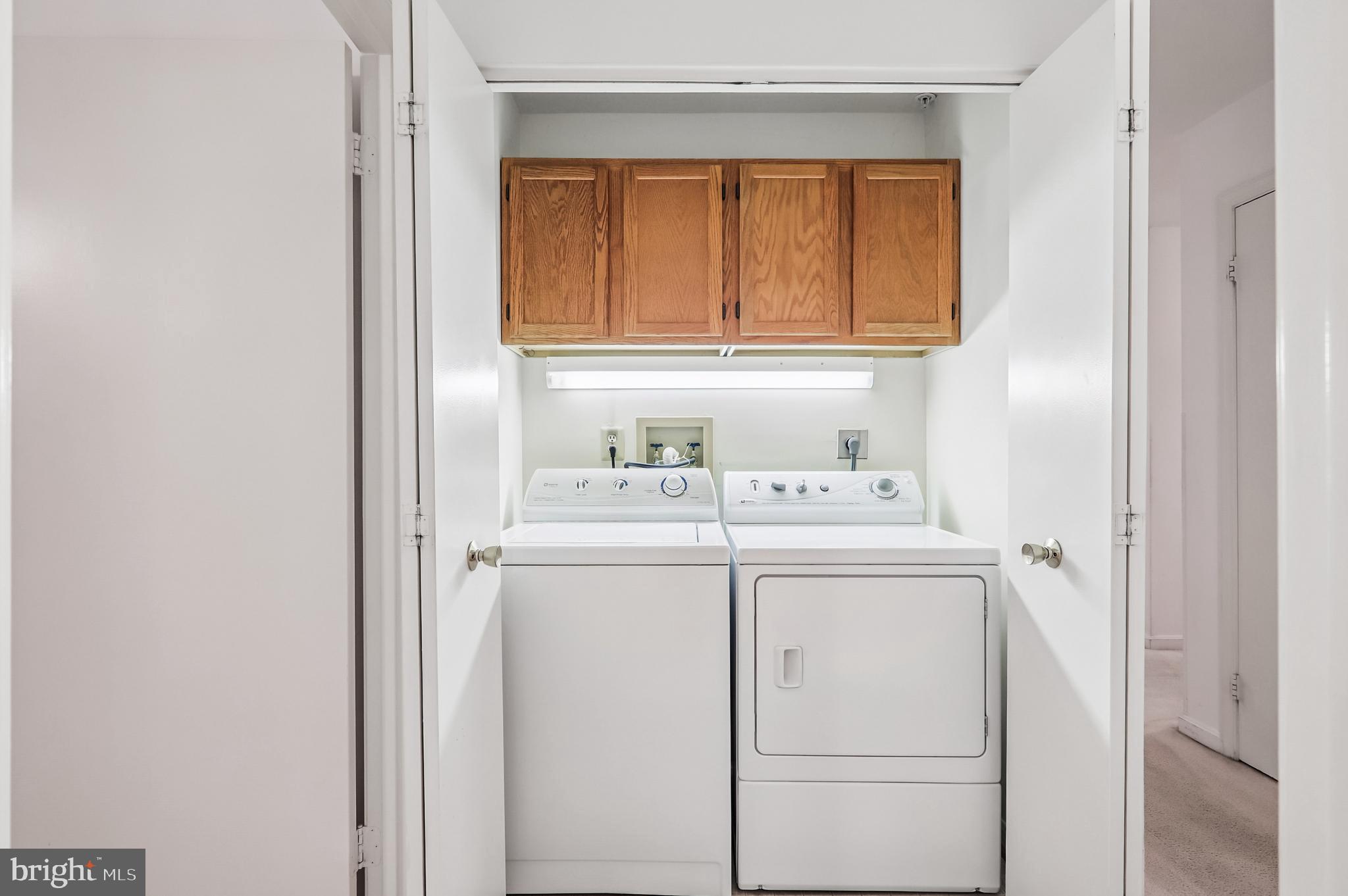 9272 Cherry Lane, Unit 75 Laurel, MD 20708 - Photo 26 of 37 a utility room with dryer and washer