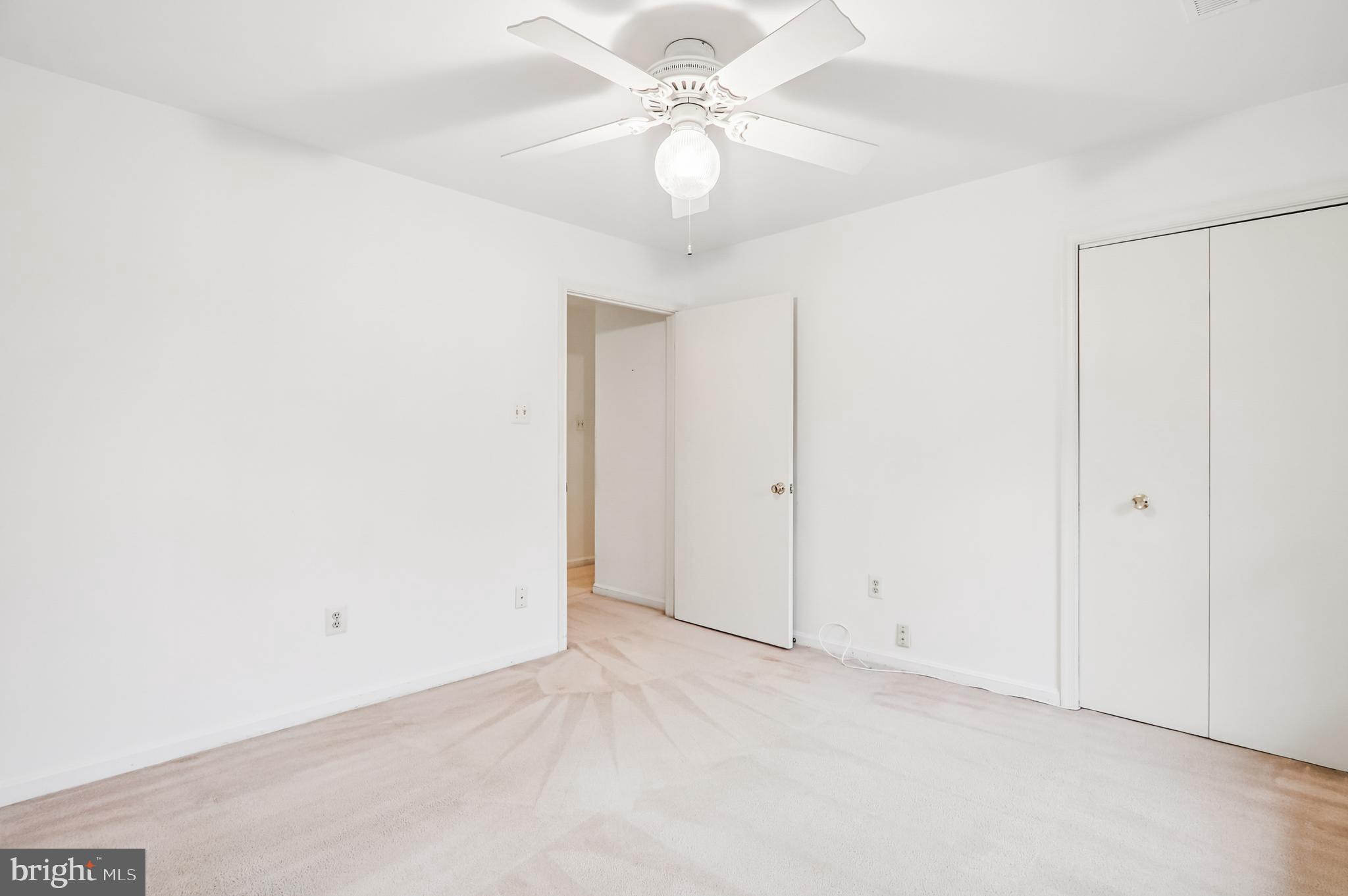 9272 Cherry Lane, Unit 75 Laurel, MD 20708 - Photo 29 of 37 a view of a room with a ceiling fan and a window
