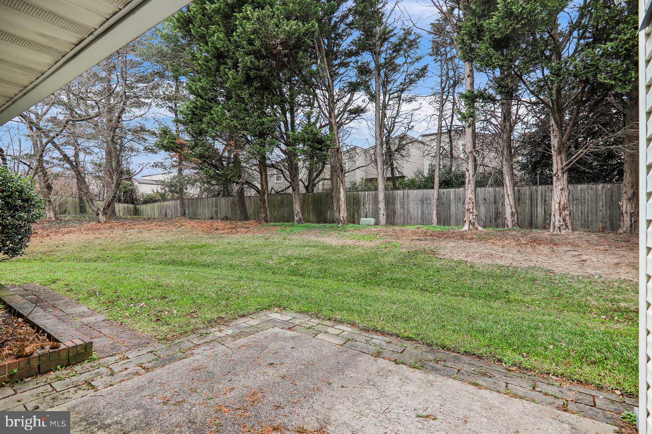 9272 Cherry Lane, Unit 75 Laurel, MD 20708 - Photo 31 of 37 a backyard of a house with lots of green space