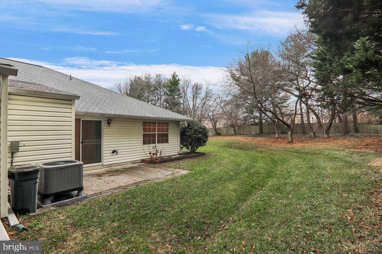 9272 Cherry Lane, Unit 75 Laurel, MD 20708 - Photo 35 of 37 a view of a house with backyard and trees