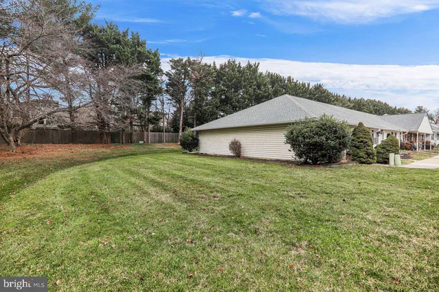 a view of a house with a back yard