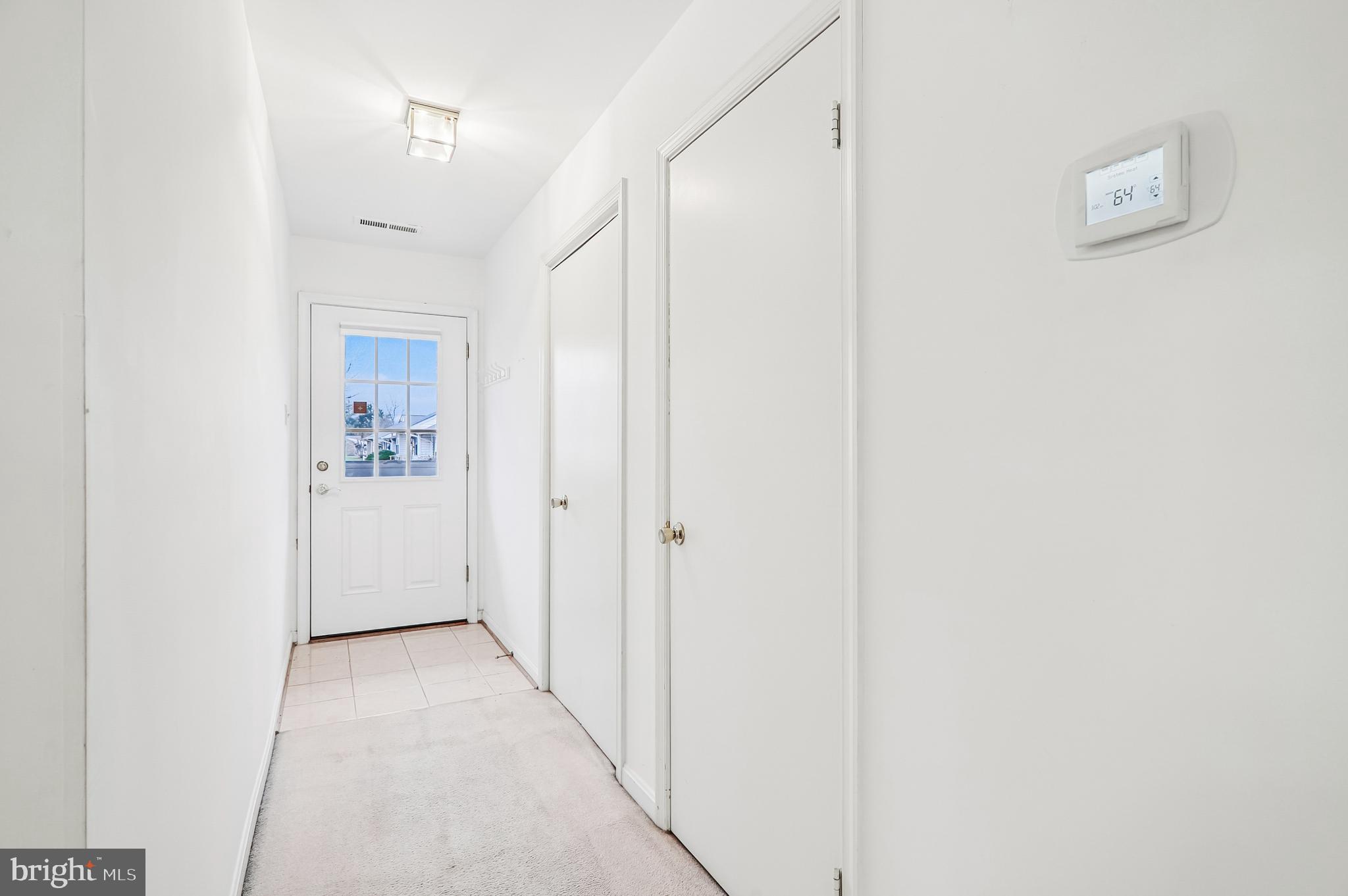 9272 Cherry Lane, Unit 75 Laurel, MD 20708 - Photo 6 of 37 a view of a hallway with wooden floor