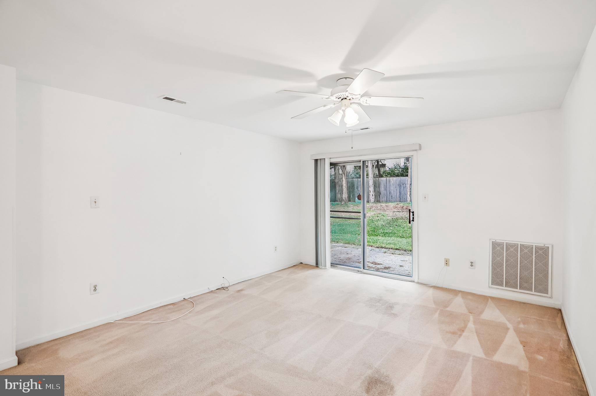 9272 Cherry Lane, Unit 75 Laurel, MD 20708 - Photo 9 of 37 a view of an empty room with a window
