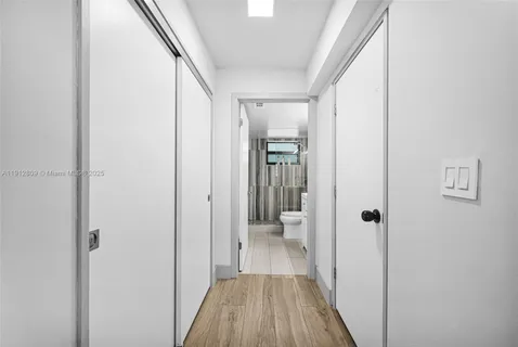 a view of a bathroom from a hallway