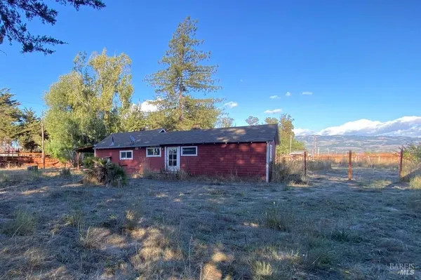 a view of a barn with a yard