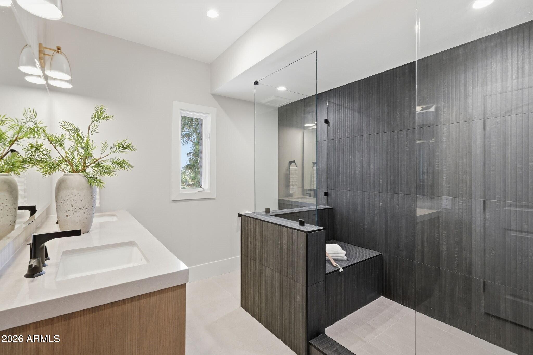 7475 East Gainey Ranch Road, Unit 7 Scottsdale, AZ 85258 - Photo 50 of 77 a bathroom with a sink vanity granite and a mirror