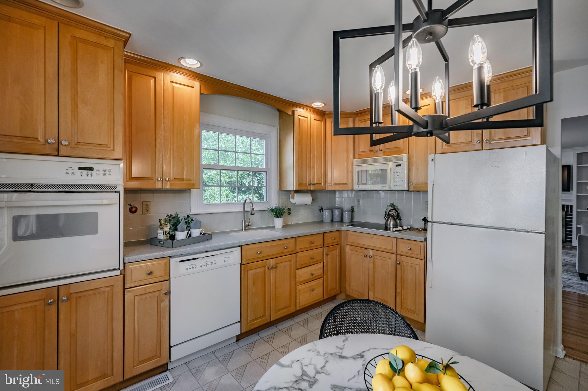 30 Llandillo Road Havertown, PA 19083 - Photo 15 of 47 a kitchen with white cabinets and white appliances