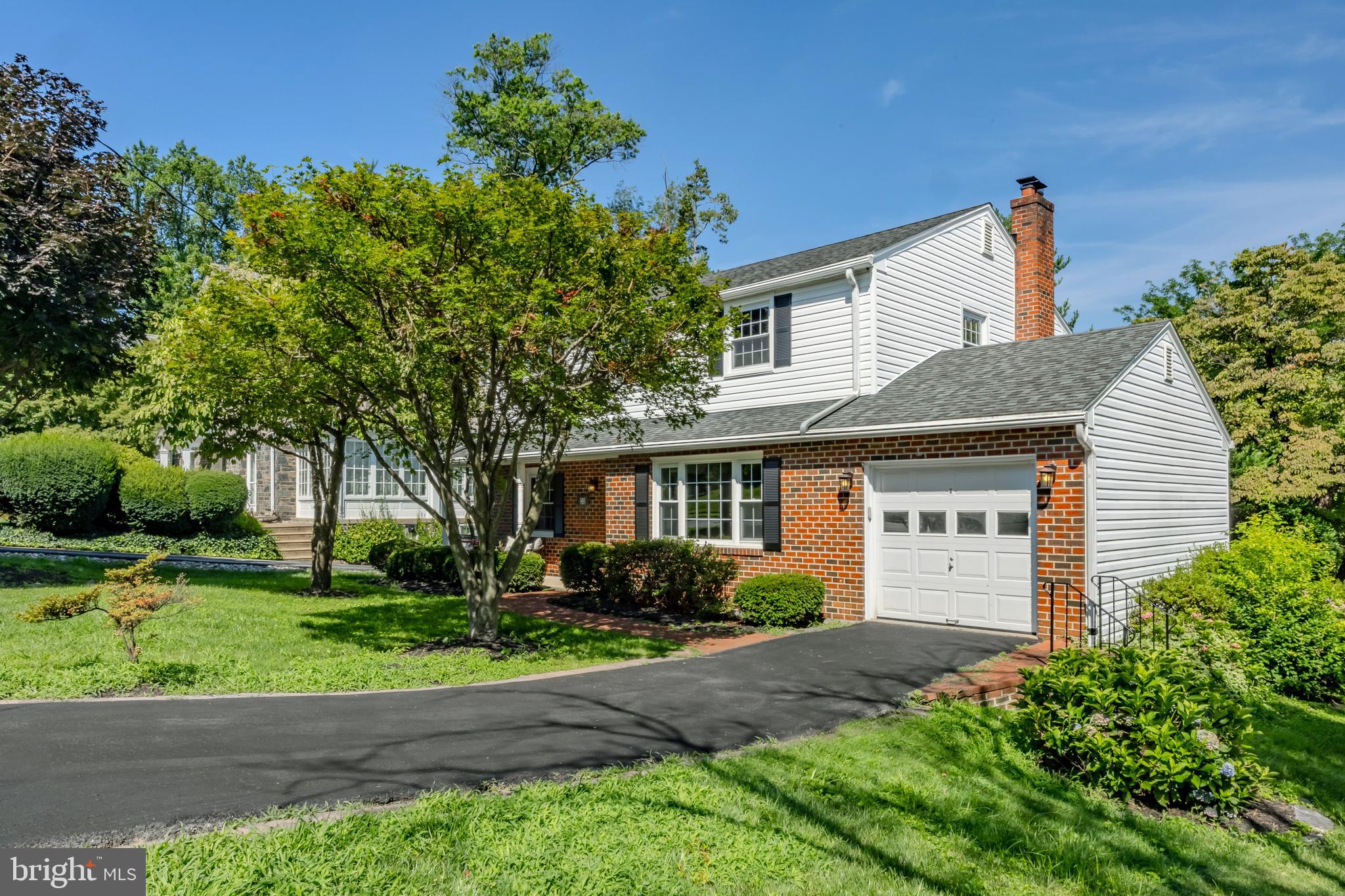 30 Llandillo Road Havertown, PA 19083 - Photo 3 of 47 a front view of a house with a yard and a garage