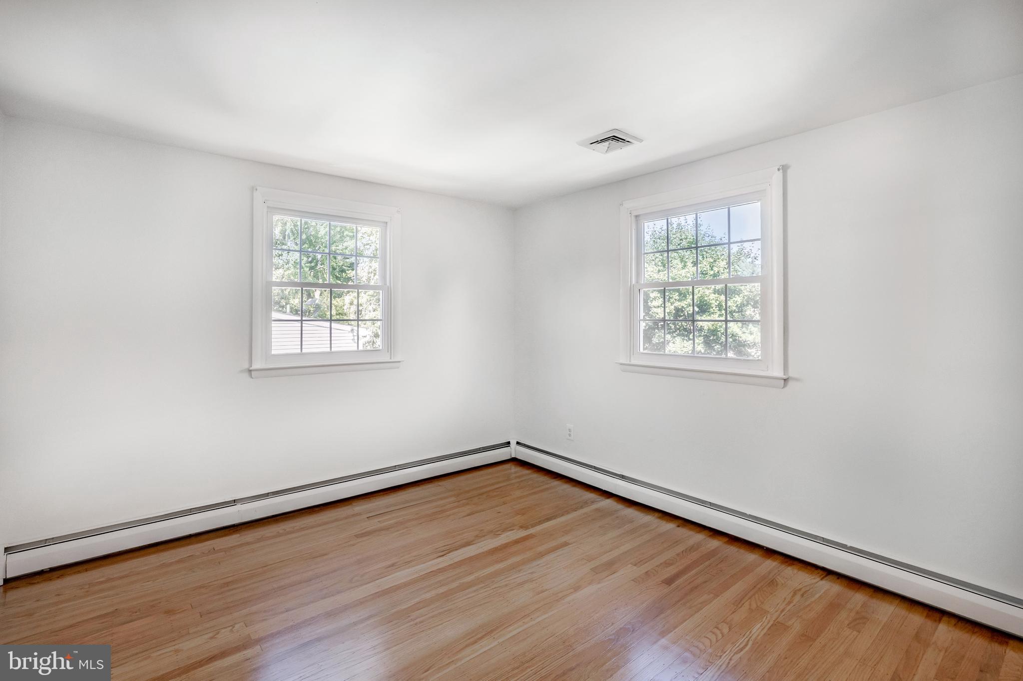 30 Llandillo Road Havertown, PA 19083 - Photo 36 of 47 wooden floor in an empty room with a window