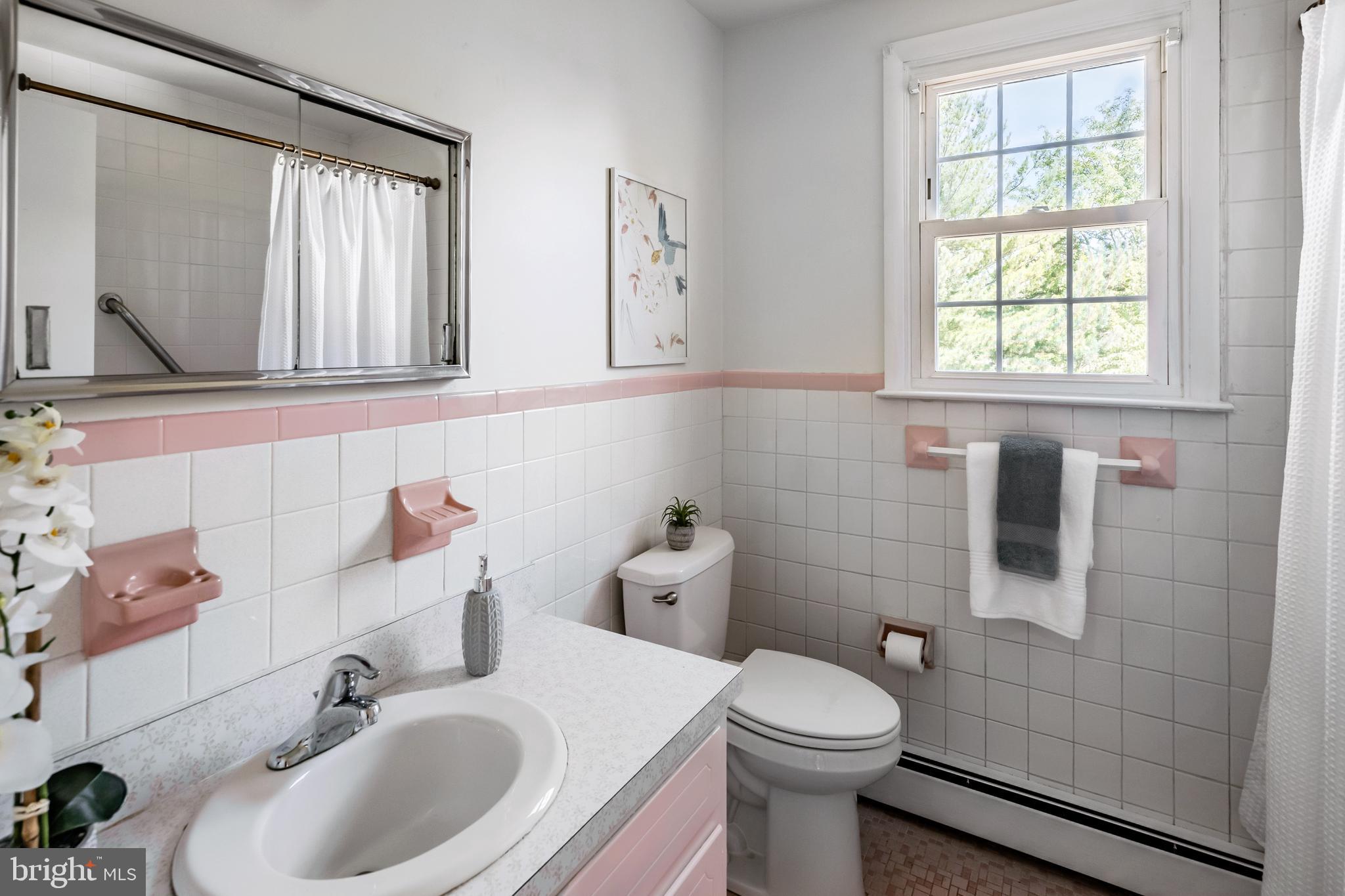 30 Llandillo Road Havertown, PA 19083 - Photo 40 of 47 a bathroom with a sink a toilet and a mirror