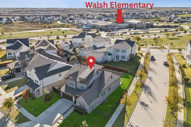 an aerial view of houses with outdoor space