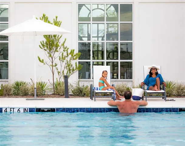 a view of swimming pool with a lounge chair