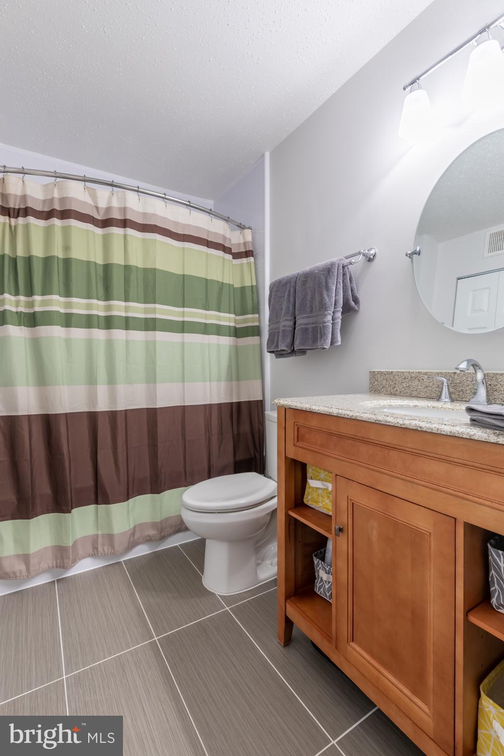 131 Fort Evans Road Southeast, Unit D Leesburg, VA 20175 - Photo 12 of 17 Updated master bath boasts lovely ceramic tile