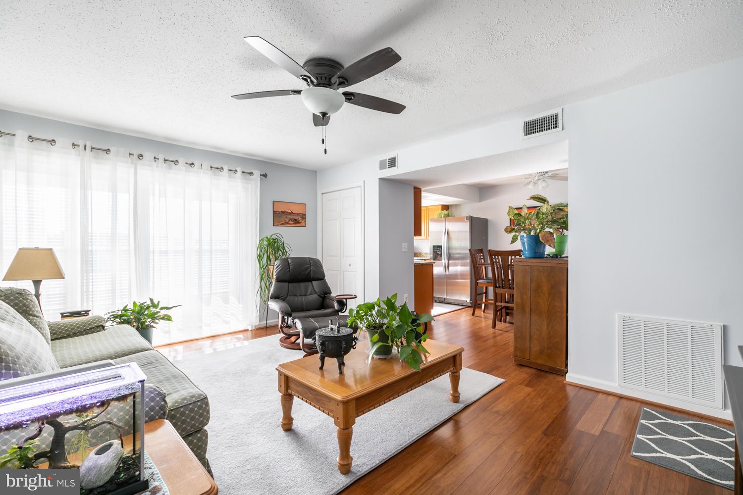131 Fort Evans Road Southeast, Unit D Leesburg, VA 20175 - Photo 3 of 17 Spacious living room with new hardwood flooring