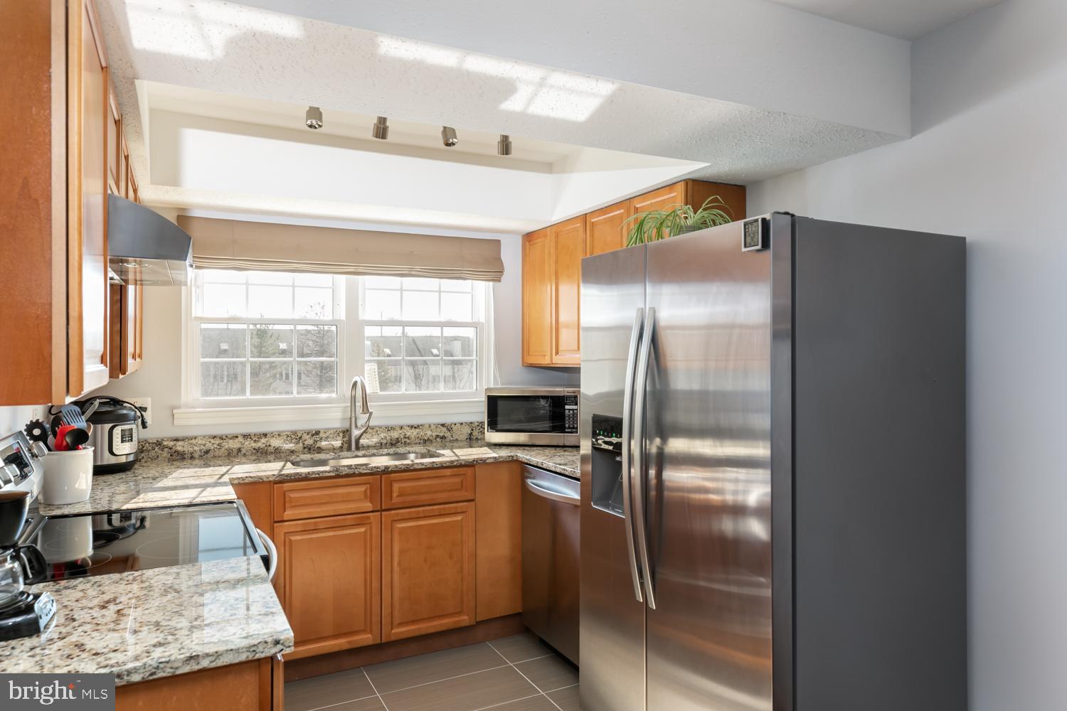 131 Fort Evans Road Southeast, Unit D Leesburg, VA 20175 - Photo 7 of 17 Sunny gourmet kitchen with view of common area