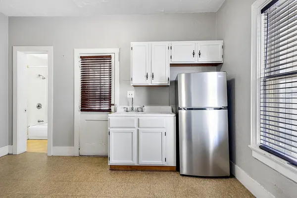 a kitchen with refrigerator a stove a sink and dishwasher