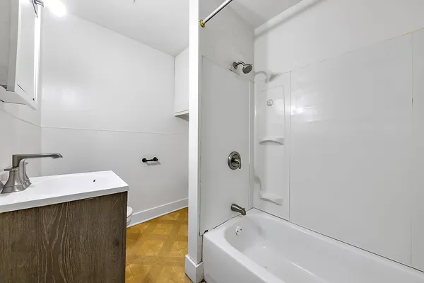 a bathroom with a bathtub and a sink