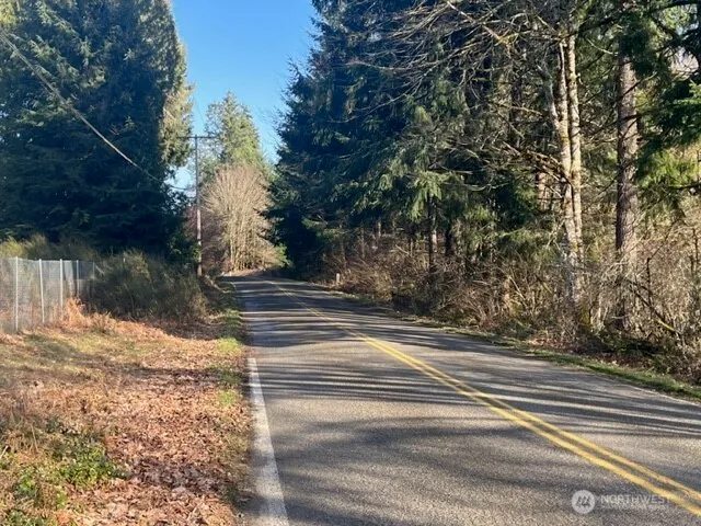 a view of street along with trees