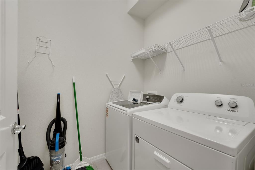 4450 Kaipo Road Davenport, FL 33897 - Photo 12 of 66 a utility room with dryer and washer