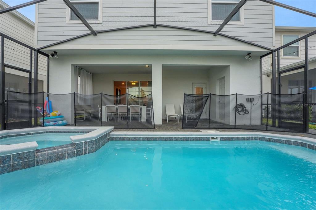 4450 Kaipo Road Davenport, FL 33897 - Photo 18 of 66 swimming pool view with a outdoor seating space