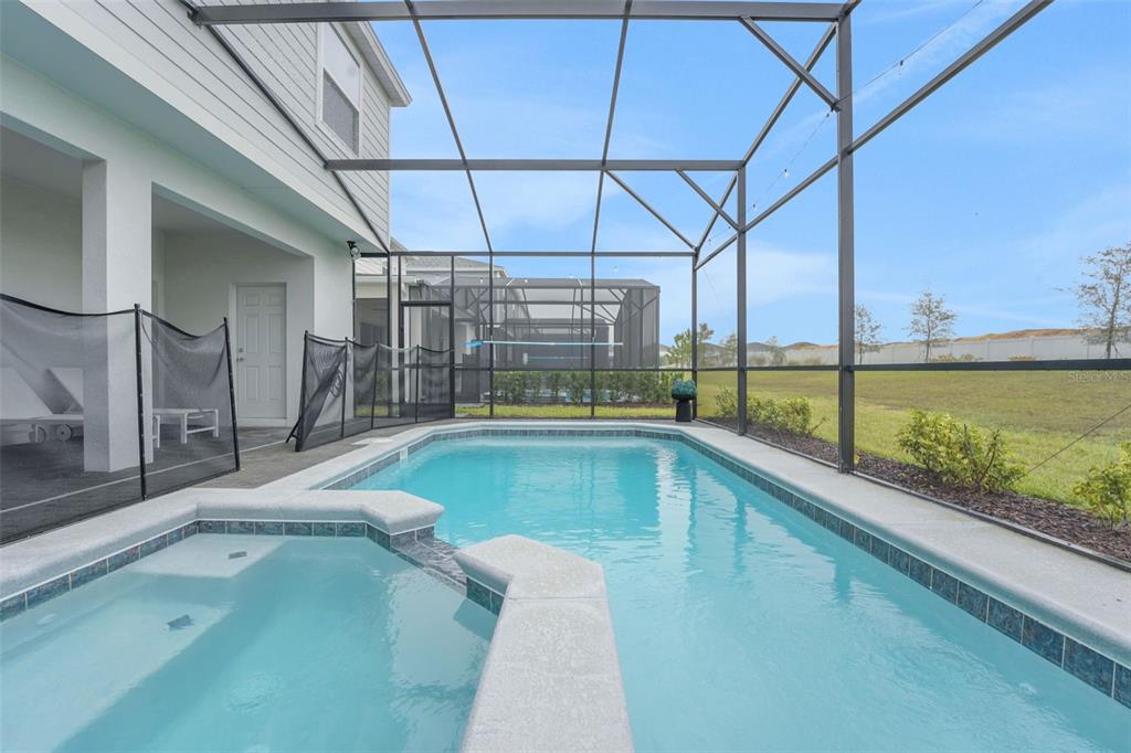 4450 Kaipo Road Davenport, FL 33897 - Photo 19 of 66 a view of a swimming pool with a patio
