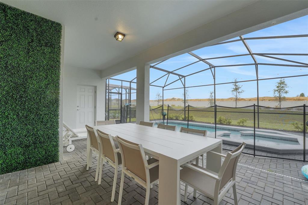 4450 Kaipo Road Davenport, FL 33897 - Photo 22 of 66 a view of an outside dining space with furniture