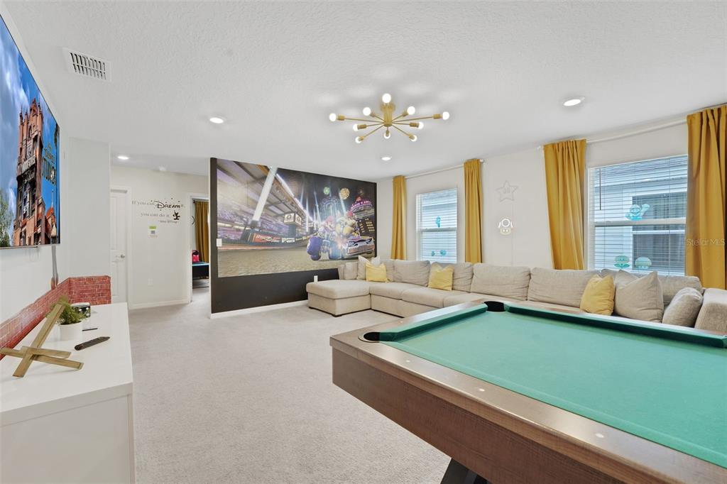 4450 Kaipo Road Davenport, FL 33897 - Photo 35 of 66 a room with furniture and a large window