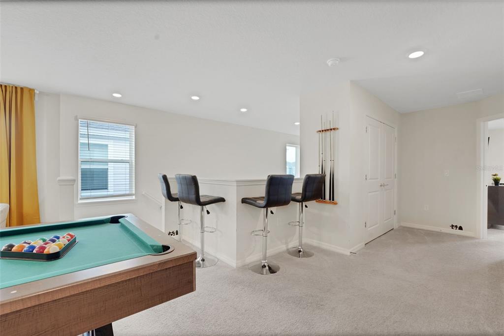 4450 Kaipo Road Davenport, FL 33897 - Photo 36 of 66 a living room with furniture and a window
