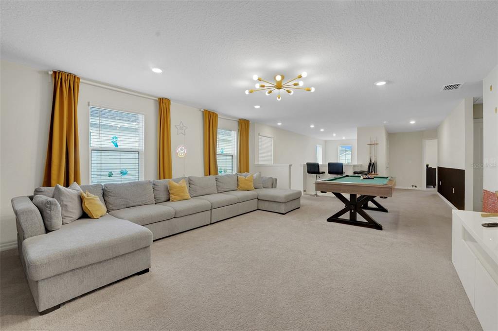 4450 Kaipo Road Davenport, FL 33897 - Photo 37 of 66 a living room with furniture and a large window