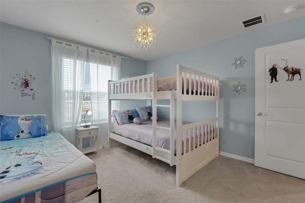 4450 Kaipo Road Davenport, FL 33897 - Photo 38 of 66 a bedroom with bed and a window