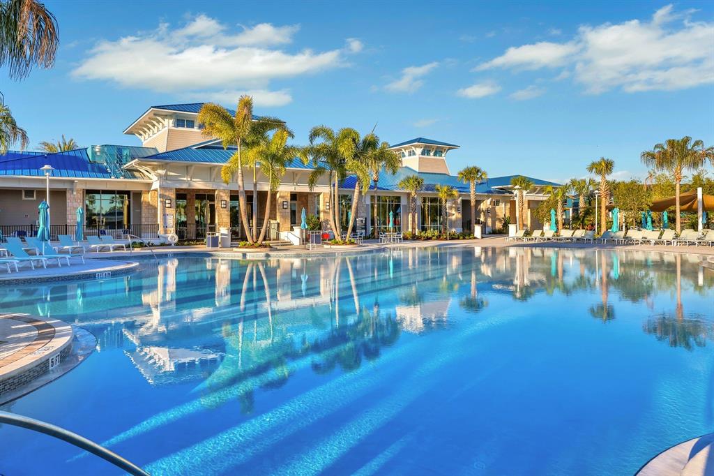 4450 Kaipo Road Davenport, FL 33897 - Photo 55 of 66 a view of a swimming pool with outdoor seating