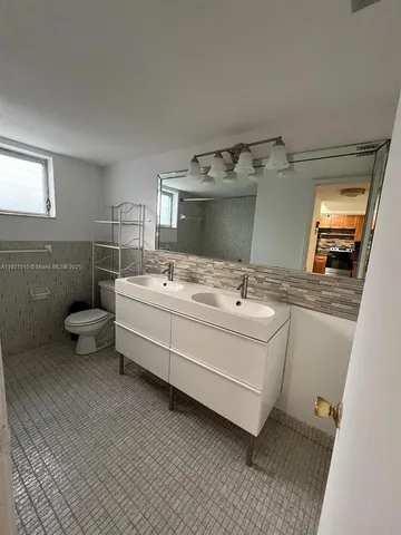 a bathroom with a sink and mirror