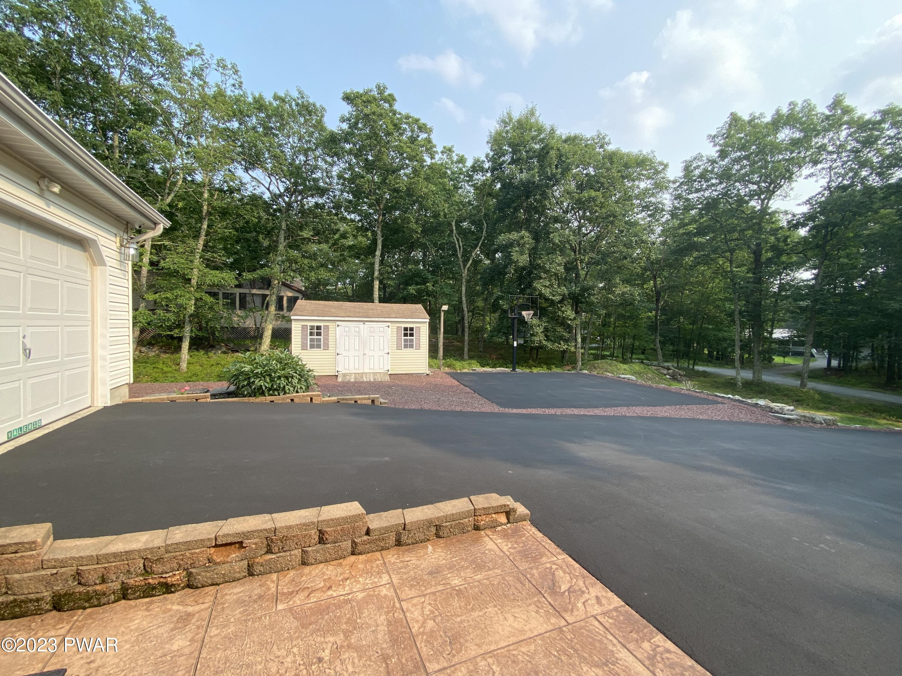 126 Maple Ridge Road Milford, PA 18337 - Photo 4 of 52 a backyard of a house with lots of green space