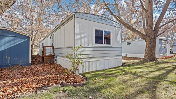 a view of a house with a yard covered in snow