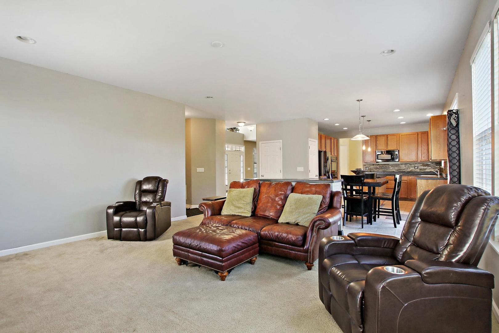 1230 Bellows Way Volo, IL 60073 - Photo 16 of 32 a living room with furniture kitchen and a table
