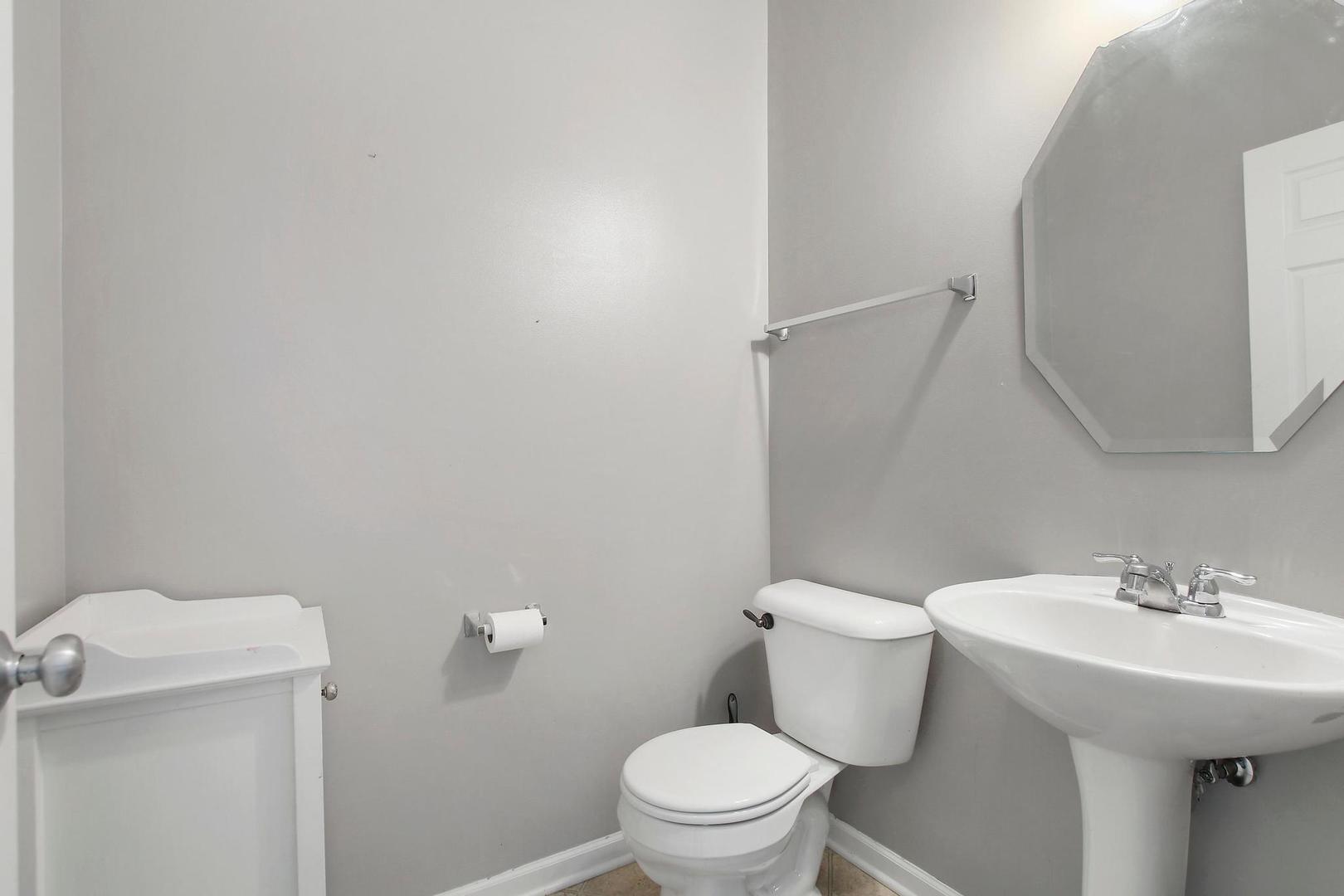 1230 Bellows Way Volo, IL 60073 - Photo 17 of 32 a bathroom with a sink a toilet and a mirror