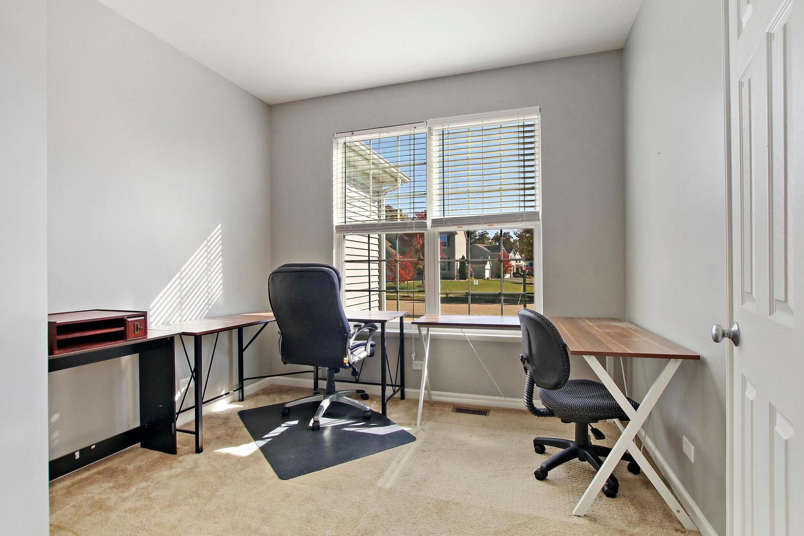 1230 Bellows Way Volo, IL 60073 - Photo 6 of 32 a view of a workspace with furniture and a window