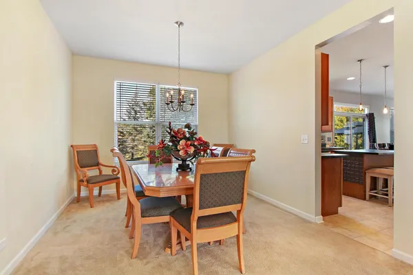 a dining room with furniture and window