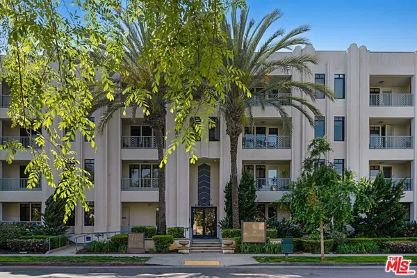 a front view of a multi story residential apartment buildings