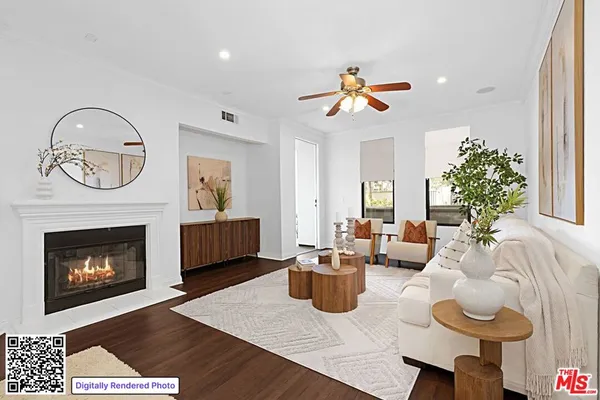 a living room with furniture kitchen view and a fireplace