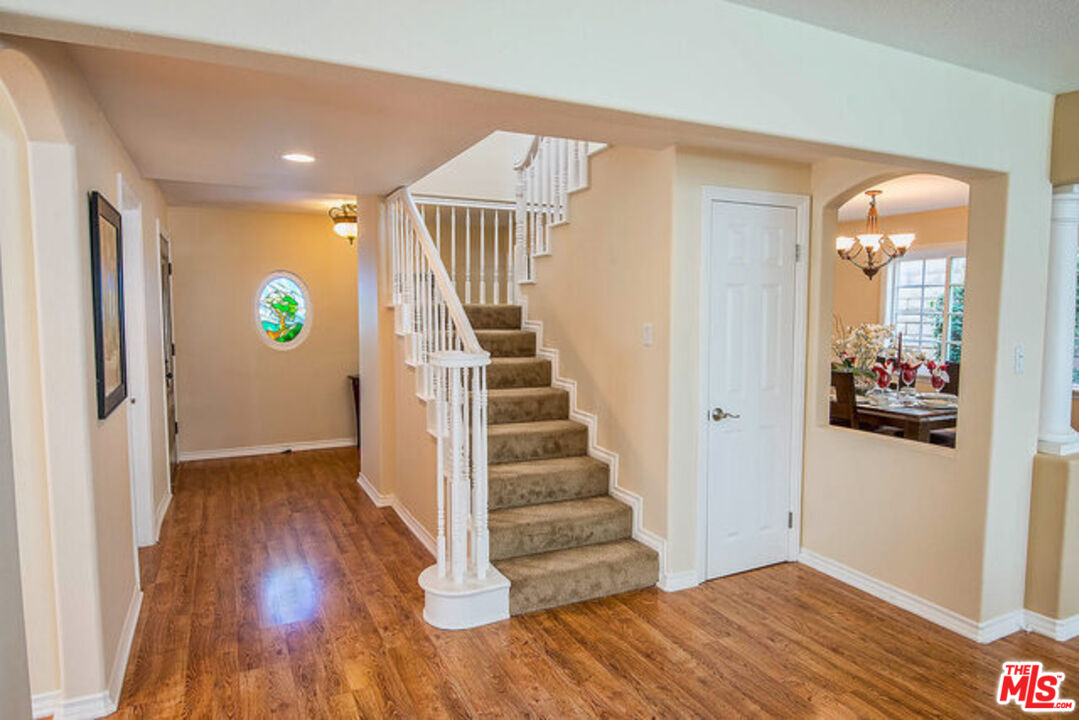 7830 West 83rd Street Playa del Rey, CA 90293 - Photo 12 of 74 a view of an entryway with wooden floor