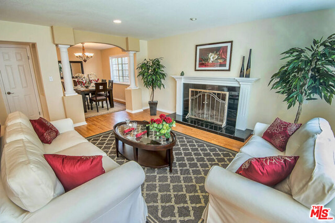 7830 West 83rd Street Playa del Rey, CA 90293 - Photo 13 of 74 a living room with furniture and a fireplace