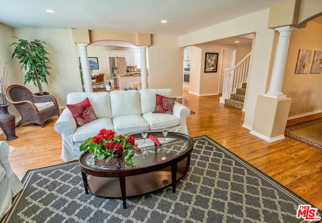 7830 West 83rd Street Playa del Rey, CA 90293 - Photo 14 of 74 a living room with furniture and flowers