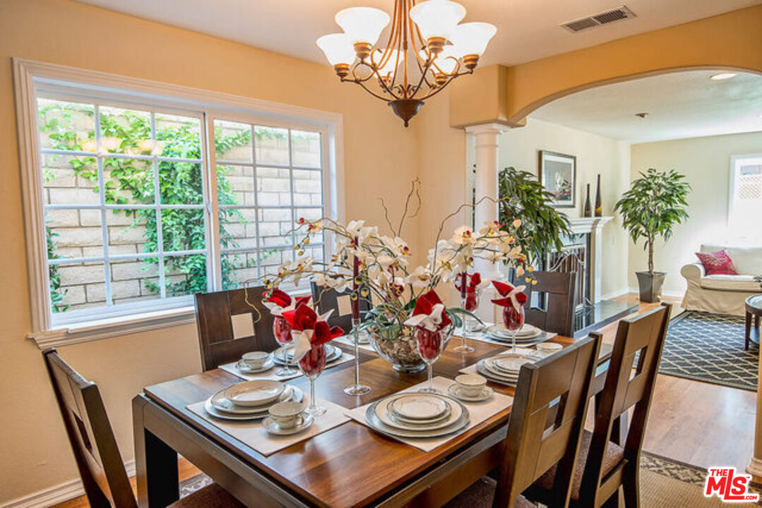 7830 West 83rd Street Playa del Rey, CA 90293 - Photo 16 of 74 a view of a dining room with furniture window and wooden floor