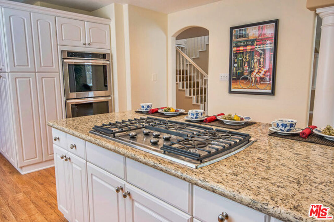 7830 West 83rd Street Playa del Rey, CA 90293 - Photo 25 of 74 a kitchen with stove and cabinets