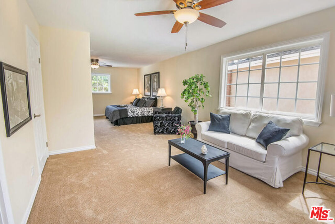 7830 West 83rd Street Playa del Rey, CA 90293 - Photo 32 of 74 a living room with furniture and a large window