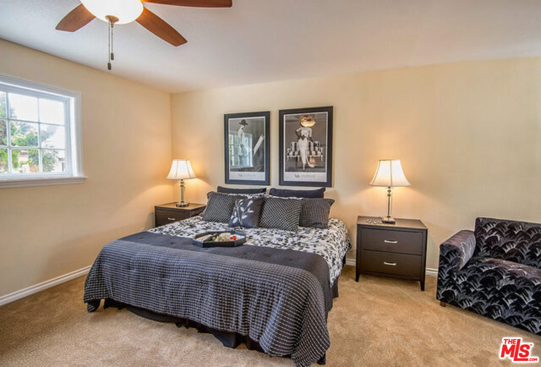 7830 West 83rd Street Playa del Rey, CA 90293 - Photo 35 of 74 a bedroom with a bed and a lamp